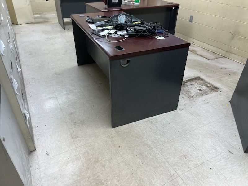 Office room with old and cracked floor tiles