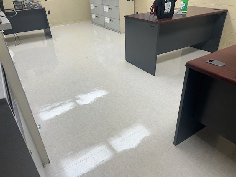 Office room with shiny and white floor tiles