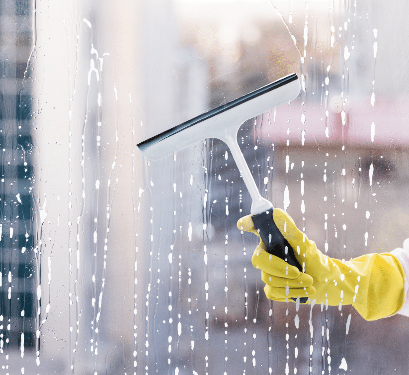 close up shot of hand man cleaning window